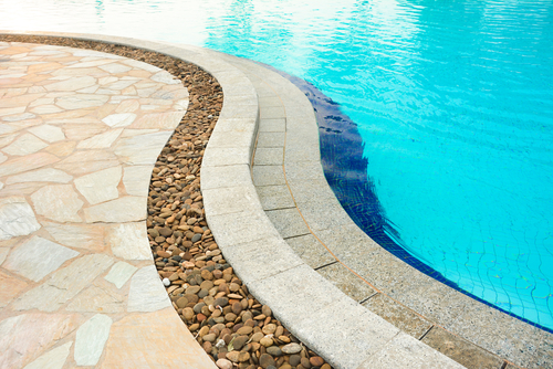 Curved,Swimming,Pool,Coping,,Made,Of,Stones