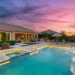 A,Home,Pool,At,Sunset